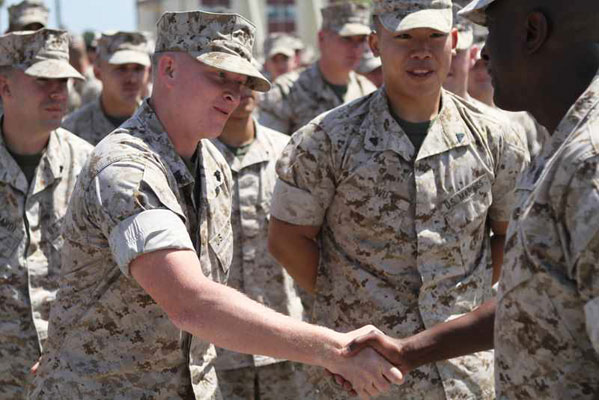 Image of two marines shaking hands