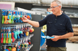 Image of man shopping for his puppy
