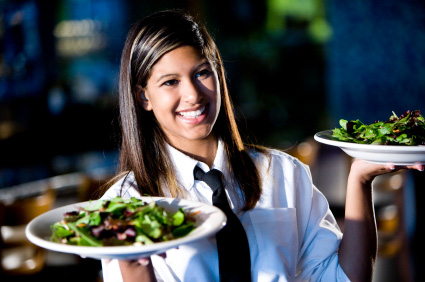 Image of waitress holding two orders ready to serve